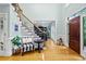 Spacious foyer featuring hardwood floors, staircase, and bright lighting at 130 Silver Mist Cir, Alpharetta, GA 30022