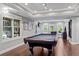 The basement game room features a pool table, foosball table, and access to the backyard at 130 Silver Mist Cir, Alpharetta, GA 30022