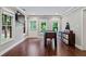 Bright game room with foosball table and backyard access through glass doors and windows at 130 Silver Mist Cir, Alpharetta, GA 30022