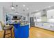 Open kitchen boasts an island, modern appliances, and eat-in breakfast area at 130 Silver Mist Cir, Alpharetta, GA 30022
