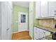 Pantry and kitchen area features natural light and great storage at 130 Silver Mist Cir, Alpharetta, GA 30022