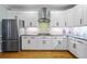 Gourmet kitchen features stainless steel appliances, granite countertops, and sleek cabinetry at 130 Silver Mist Cir, Alpharetta, GA 30022