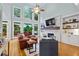 Spacious living room boasting large windows, a stone fireplace, and comfortable seating at 130 Silver Mist Cir, Alpharetta, GA 30022