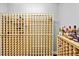 Spacious wine room with custom wood racking and shelving for liquor bottles at 130 Silver Mist Cir, Alpharetta, GA 30022