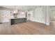 Modern kitchen featuring a large island, stainless steel appliances, and white cabinetry for an elegant design at 133 Daxton Dr, Canton, GA 30115