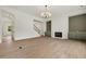 Spacious living area featuring modern staircase, beautiful fireplace, and ample natural light at 133 Daxton Dr, Canton, GA 30115