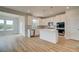 Bright, modern kitchen featuring stainless steel appliances and a center island open to the living area at 247 Arnewood Cir, Mcdonough, GA 30253