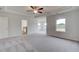 Large main bedroom features gray carpet, neutral paint, and an ensuite bathroom at 247 Arnewood Cir, Mcdonough, GA 30253