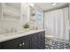 Updated bathroom with double vanity, stylish fixtures, and patterned tile flooring at 615 Sycamore Dr, Decatur, GA 30030