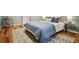 Bedroom features hardwood floors and a plush rug beneath the bed at 615 Sycamore Dr, Decatur, GA 30030