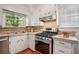 Cozy kitchen with stainless steel appliances and tiled countertops at 615 Sycamore Dr, Decatur, GA 30030