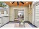 Cozy covered porch with a ceiling fan, offering a view into the dining room at 615 Sycamore Dr, Decatur, GA 30030