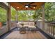 Relaxing screened-in porch with comfortable seating, ceiling fan, and a serene view of the surrounding greenery at 615 Sycamore Dr, Decatur, GA 30030