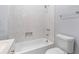 Bright bathroom featuring a shower and tub combination with decorative tile work at 1363 Jonesboro Se Rd, Atlanta, GA 30315