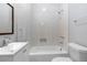 Bathroom featuring a shower and tub combination with decorative tile work and modern fixtures at 1363 Jonesboro Se Rd, Atlanta, GA 30315