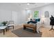 Bright bedroom with ceiling fan, natural light, and decorative furnishings at 1363 Jonesboro Se Rd, Atlanta, GA 30315