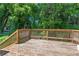 Wood deck, bordered by lush greenery, offering a serene outdoor space at 1363 Jonesboro Se Rd, Atlanta, GA 30315