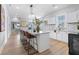 Spacious kitchen with a large island, granite countertops, and modern stainless steel appliances at 1363 Jonesboro Se Rd, Atlanta, GA 30315