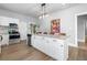 Modern kitchen with a large island, white cabinets, and stainless steel appliances at 1363 Jonesboro Se Rd, Atlanta, GA 30315