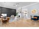 Bright living room featuring a decorative fireplace, hardwood floors, and contemporary furnishings at 1363 Jonesboro Se Rd, Atlanta, GA 30315
