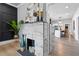 Living room showcasing a modern fireplace, hardwood floors, and open access to the kitchen at 1363 Jonesboro Se Rd, Atlanta, GA 30315