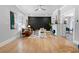Open-concept living room showcasing stylish furnishings, hardwood floors, and ample natural light at 1363 Jonesboro Se Rd, Atlanta, GA 30315