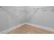 Spacious walk-in closet with wooden floors, and wire shelving for optimal organization at 1363 Jonesboro Se Rd, Atlanta, GA 30315