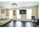Bright living room featuring hardwood floors, modern lighting, and multiple windows for natural light at 3302 Waldrop Trl, Decatur, GA 30034