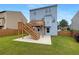 Spacious backyard featuring a deck, patio, grassy area, and partial fence, ideal for outdoor living at 3695 Santa Rosa Way, Douglasville, GA 30135