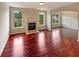 Spacious living room with hardwood floors and fireplace, offering a cozy and inviting atmosphere at 3695 Santa Rosa Way, Douglasville, GA 30135