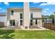 A home backyard features a patio, pergola, and grassy area at 615 Rosedown Way, Alpharetta, GA 30022