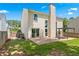 A home's backyard features a patio, pergola, and grassy area at 615 Rosedown Way, Alpharetta, GA 30022