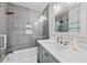 Updated bathroom features gray subway tile, a large mirror, and a modern vanity at 615 Rosedown Way, Alpharetta, GA 30022