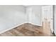 Bedroom with new floors, fresh paint, and easy access to other rooms in the home at 615 Rosedown Way, Alpharetta, GA 30022