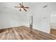 Spacious Primary bedroom with wood flooring, vaulted ceiling, and ensuite access at 615 Rosedown Way, Alpharetta, GA 30022