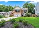 Charming brick two-story home with a well-manicured lawn and a two-car garage at 615 Rosedown Way, Alpharetta, GA 30022