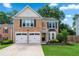 Beautiful brick home with a well-kept lawn, two-car garage and a small balcony at 615 Rosedown Way, Alpharetta, GA 30022