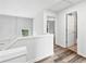 Upstairs hallway has wood floors, neutral colors, and several doors to other rooms at 615 Rosedown Way, Alpharetta, GA 30022