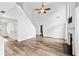 Spacious living room with vaulted ceiling, wood flooring, and cozy fireplace at 615 Rosedown Way, Alpharetta, GA 30022