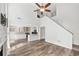 Spacious living room featuring wood floors, access to the kitchen, and tall ceilings at 615 Rosedown Way, Alpharetta, GA 30022