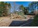 A community playground with a wooden playset and slide at 615 Rosedown Way, Alpharetta, GA 30022