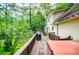 Enjoy the outdoors on the deck overlooking a charming firepit area and grassy lawn at 9018 Lakeview Pkwy, Villa Rica, GA 30180