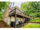 The multi-level deck connects to the basement patio and offers stunning backyard views at 9018 Lakeview Pkwy, Villa Rica, GA 30180