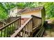 Stairway from the upper deck descends to the backyard and lower patio at 9018 Lakeview Pkwy, Villa Rica, GA 30180