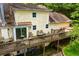 Aerial view of the deck and backyard with stone landscaping at 9018 Lakeview Pkwy, Villa Rica, GA 30180