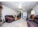 Spacious basement with tile floors and multiple seating areas at 9018 Lakeview Pkwy, Villa Rica, GA 30180