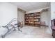 Basement area with lots of natural light, bookshelf, and exercise equipment at 9018 Lakeview Pkwy, Villa Rica, GA 30180