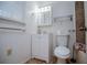 Cozy bathroom with tile flooring, a single vanity, and a medicine cabinet at 9018 Lakeview Pkwy, Villa Rica, GA 30180