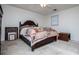 Bright bedroom featuring a decorative quilt, ceiling fan, and natural light at 9018 Lakeview Pkwy, Villa Rica, GA 30180