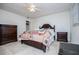 Bedroom with decorative quilt, ceiling fan, and lots of natural light at 9018 Lakeview Pkwy, Villa Rica, GA 30180